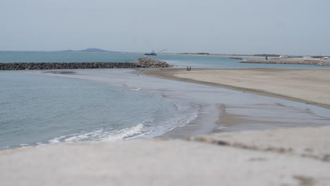 Beach-in-winter-Sete-Mediterranean-sea-France-concrete-jetty